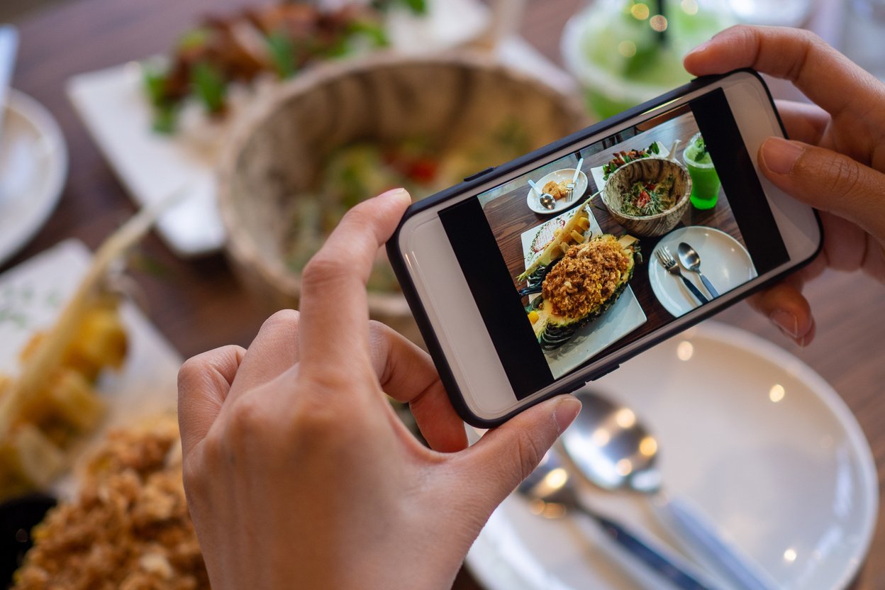 Hands Taking Photo of Meal