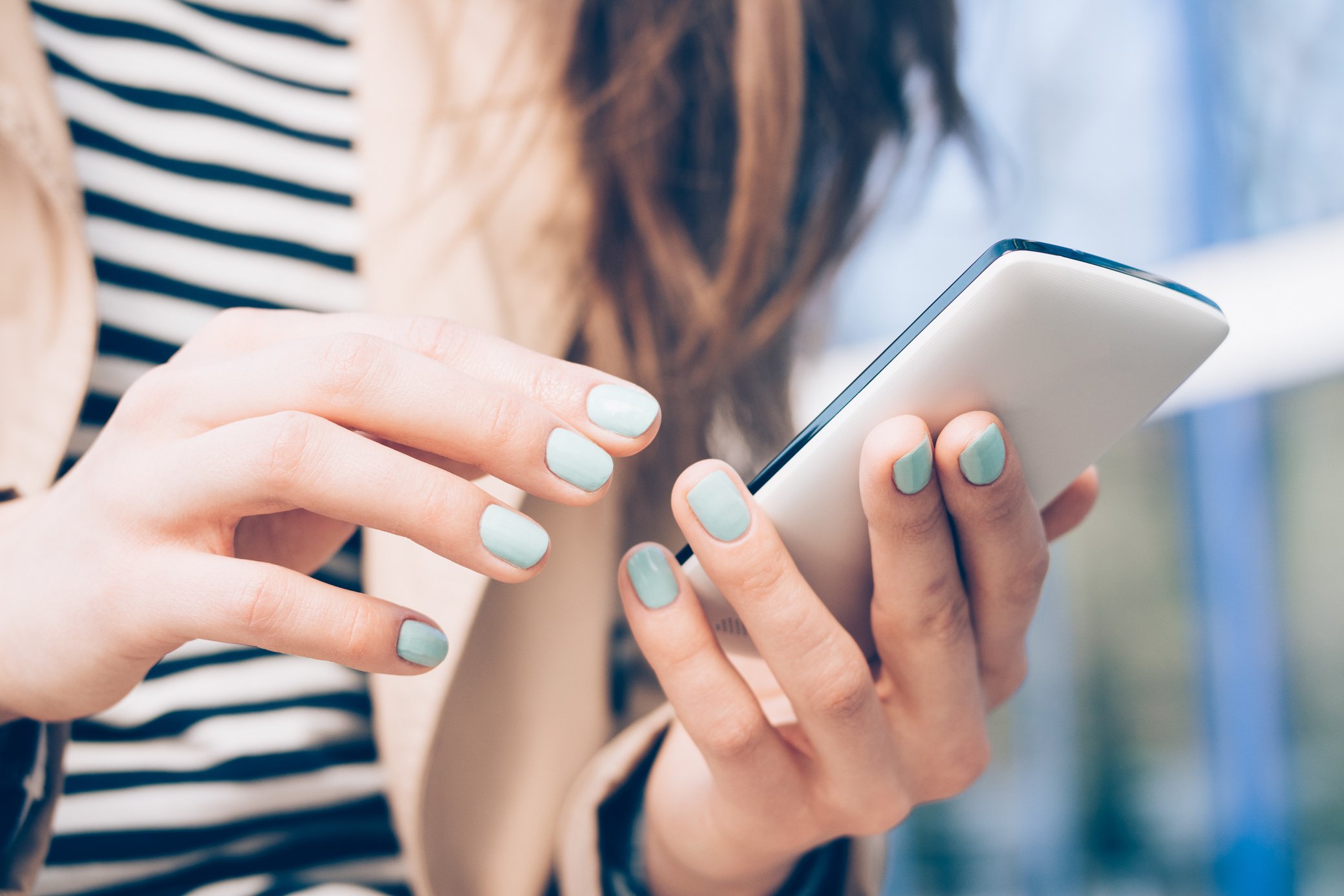 Woman Holding Mobile Phone